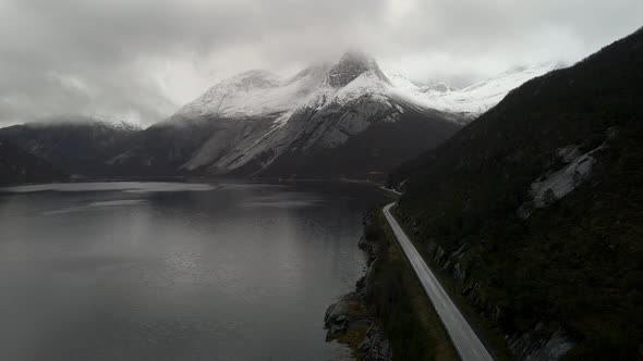 Majestic snow-covered Stetind mountain next to Tysfjord; drone flight