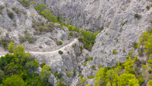 Flying Among Rocky Mountains in a Deep Prehistoric Gorge