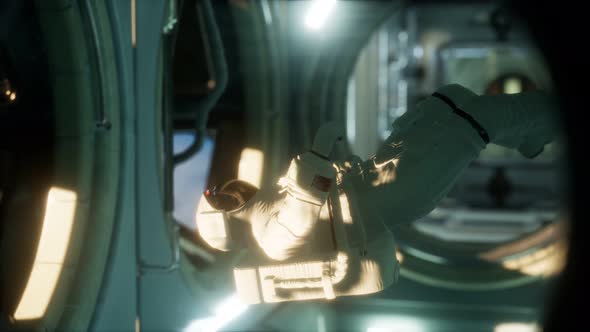 Astronaut Inside the Orbital Space Station alt
