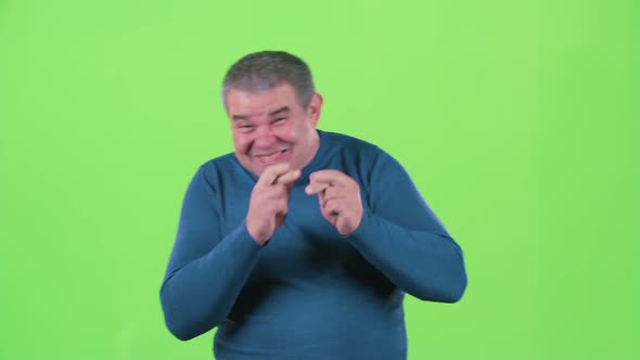 Man Crossed His Fingers. Green Screen