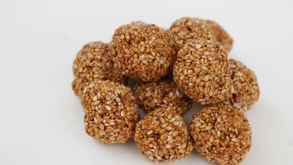 Rotating view of sesame seeds ladoo, View of sweets made from Sesame seeds