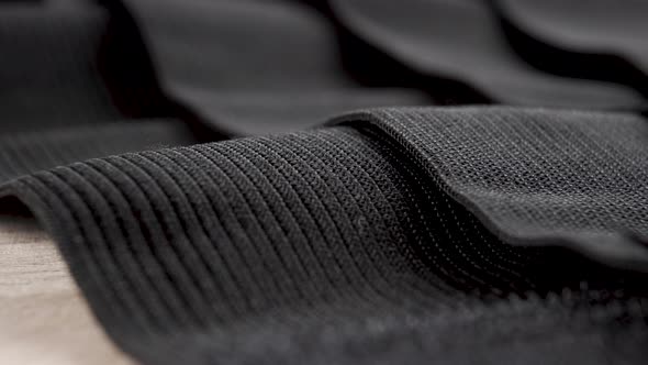 Black textured elastic textile tapes