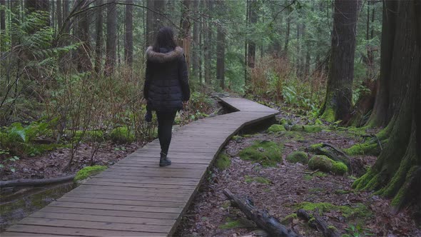 Girl Walking in the Canadian Rain Forest
