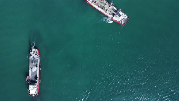 High drone view looking down at the environmental impact to a sensitive marine precinct cause by two