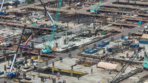 Time lapse of construction site with heavy construction machinery in metropolis