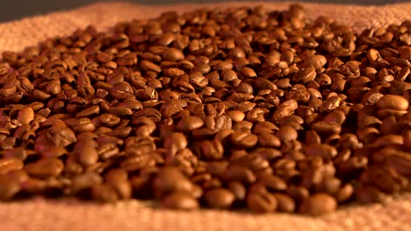 Coffee Beans on Burlap Sacking Background, Rotation, Cam Moves To the Left