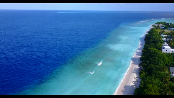 Aerial top view panorama of tranquil tourist beach voyage by clear water with bright sand background