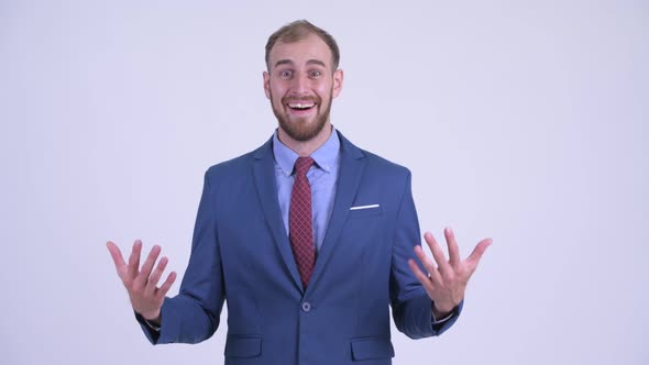 Happy Bearded Businessman Looking Surprised