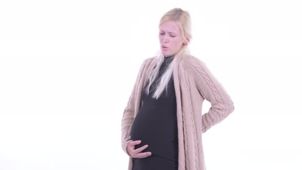 Stressed Young Blonde Pregnant Woman Having Back Pain