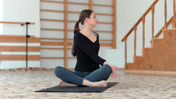 Young Beautiful Woman Doing Yoga Indoors