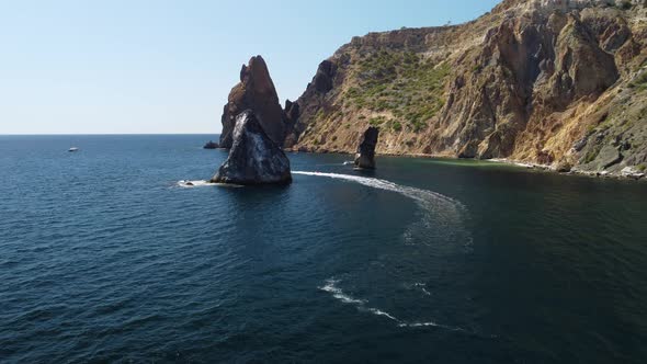 Aerial View From Above on Calm Azure Sea and Volcanic Rocky Shores