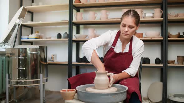 Handicraft in Pottery Workshop Female Potter Makes a Pitcher Out of Clay Handicraft Production of