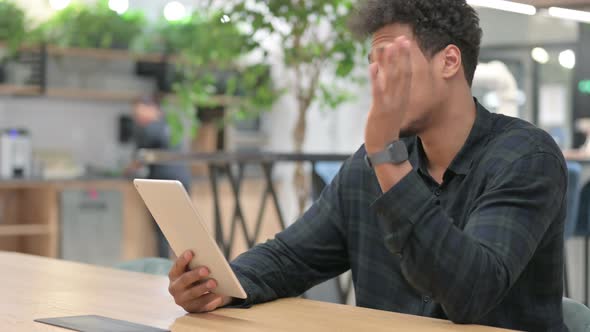 African American Man Making Video Call on Tablet