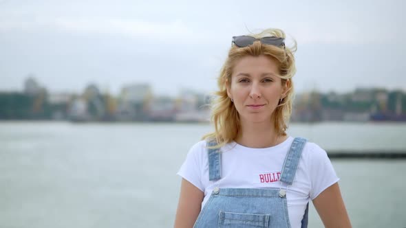 Caucasian Woman Smiling on Camera Windy Weather Portrait