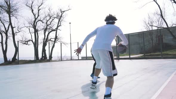 Two Basketball Player Playing Basketball Outdoors Slow Motion