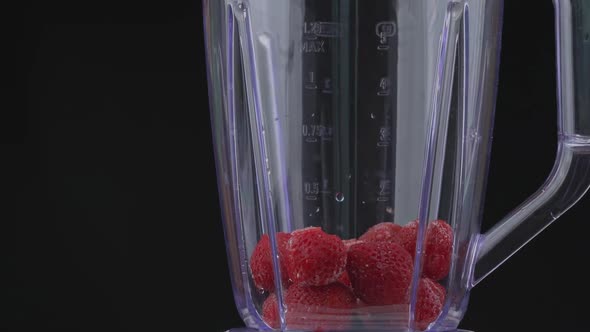 Strawberries and Currants are Poured Into the Blender Bowl