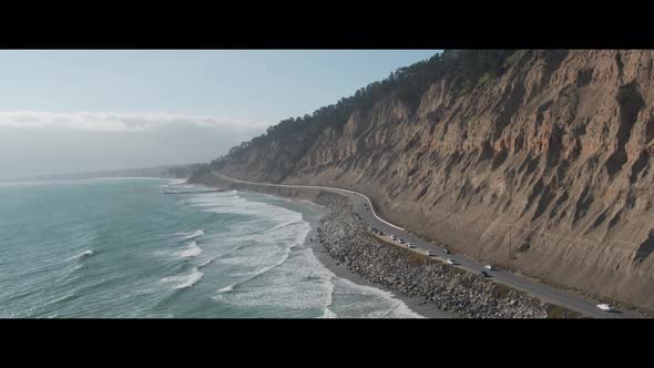Aerial Drone Shot of a Road Lining a Scenic Coastline (Pacific Coast Highway, California)