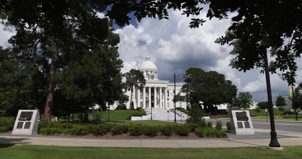 Alabama state capitol in Montgomery with gimbal video walking through trees in slow motion.