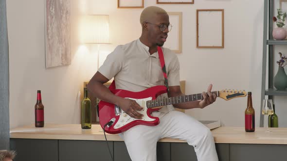 Young Black Man Playing Electric Guitar