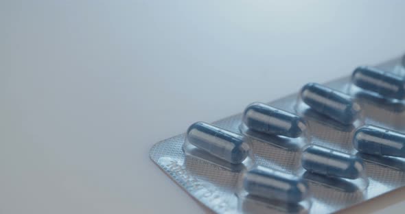 Prescription drugs - Capsules, pills, tablets on reflective background