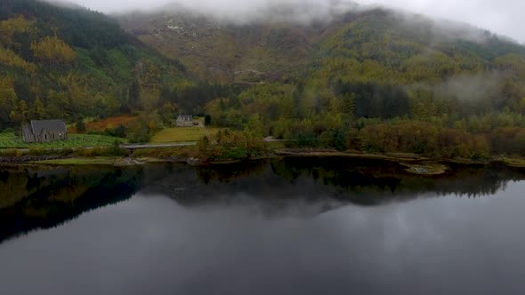 Aerial drone view of Loch Leven in Scotland on a moody misty day