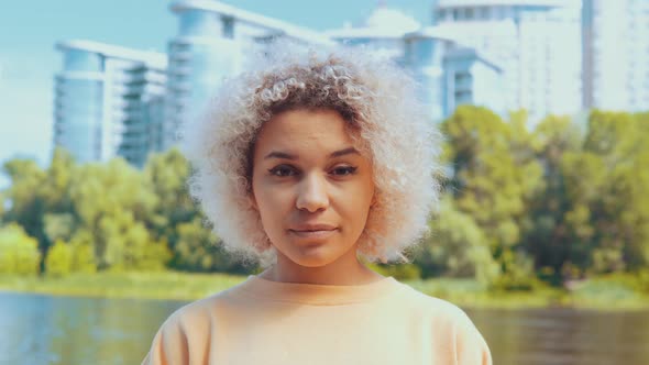 Close Up Face Young Woman with Blond Hair Outdoors