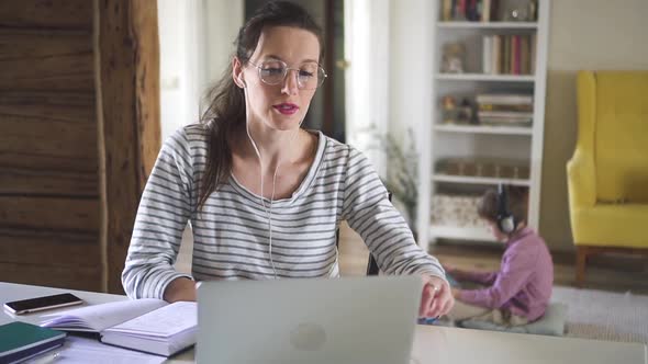 Young Businesswoman Works with Laptop Remotely at Table in Home During Selfisolation Spbd