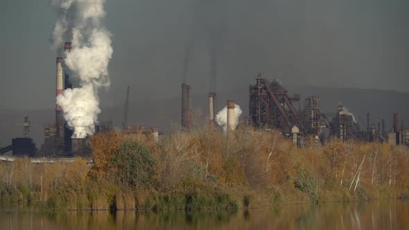 Air pollution over the city by emissions from industrial chimneys