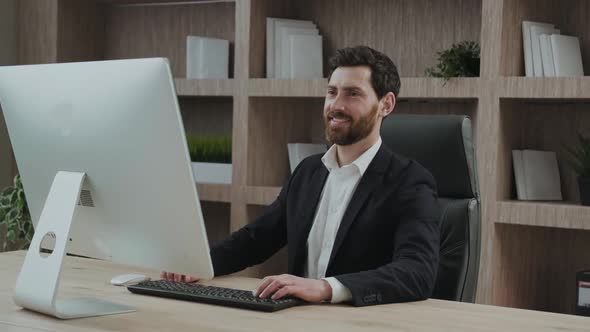 Calm and Relaxed Office Worker Satisfied with the Results and Feels Relieved in His Office Chair