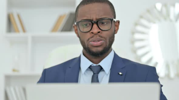 Portrait of African Businessman Making Video Call on Laptop 