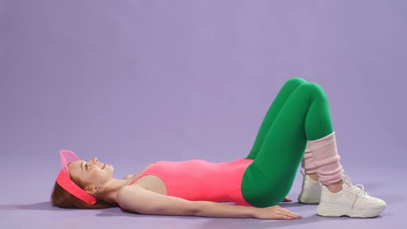 Perfectshaped Ginger Girl Making Hip Bridge Exercise