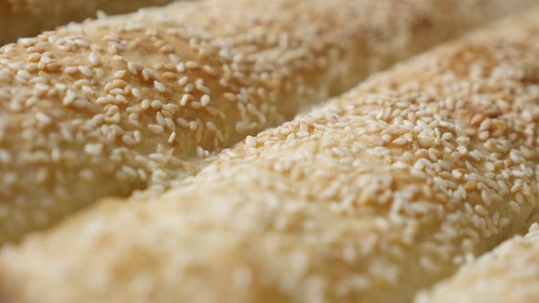 Slow tilt over filled and baked thin sheets of dough with sesame  4K 2160p 30fps UHD footage - Filo 