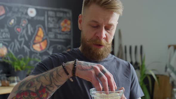 Food Blogger Showing Sesame Seeds on Camera