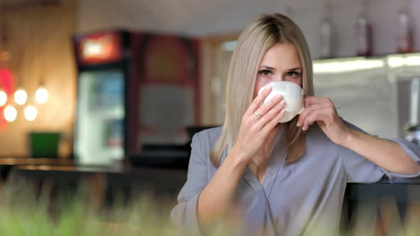 Portrait of Attractive Smiling Businesswoman Enjoying Break Drinking Coffee Holding Big White Cup