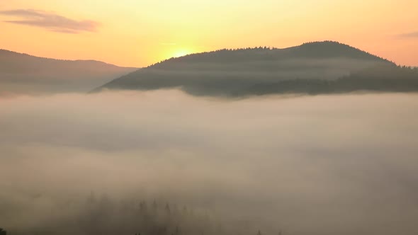 Misty Dawn in the Mountains. Beautiful Autumn Landscape