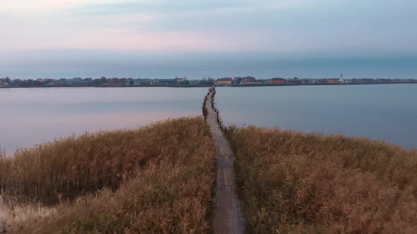 Empty bridge through estuary or lake