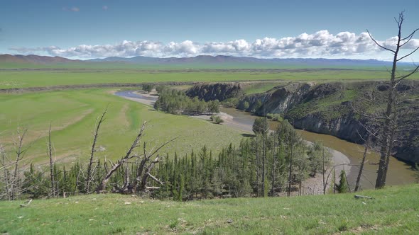 River With Rocky Walls in the Vast Plain