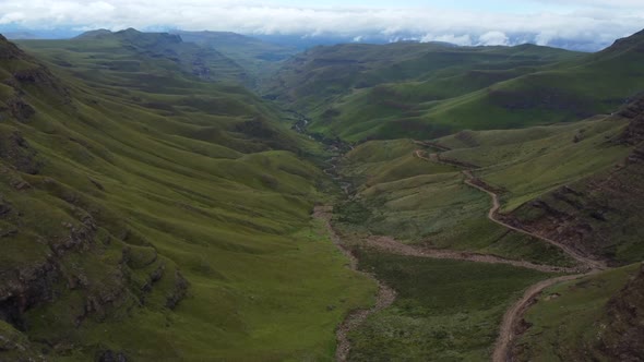 Drone shot of Drakensberg in South Africa - drone is flying over famous Sani Pass. Snippet could ide