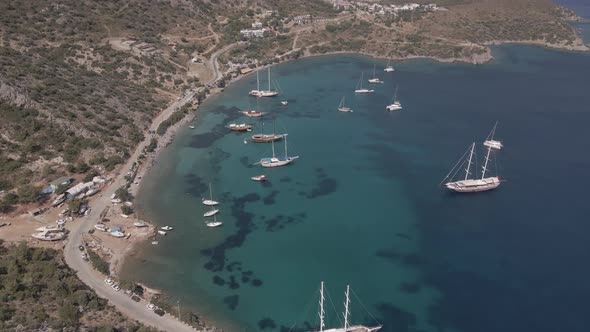 aerial view of a beautiful beach and boats. swimming people aerial.