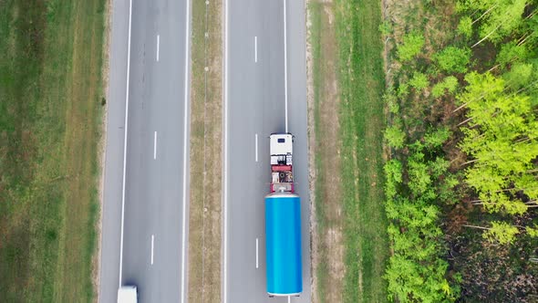 Transport Truck Carries A Large Cargo On The Highway Aerial Top View