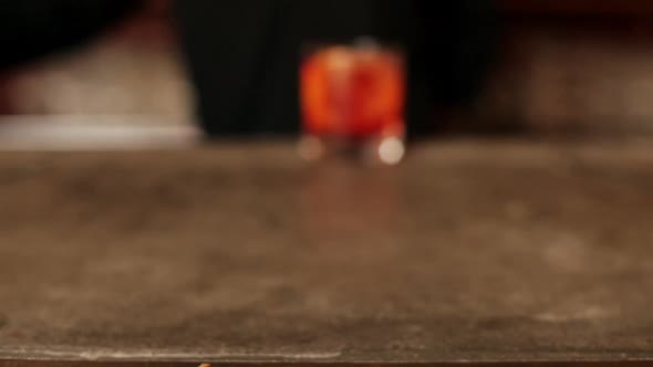 Bartender serving negroni