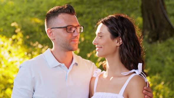 Portrait of Happy Young Couple at Summer Park