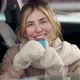 Happy young caucasian woman with thermo cup sitting inside the car in winter and warming up - VideoHive Item for Sale