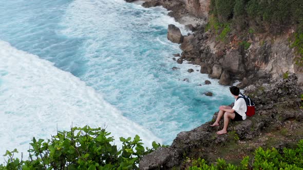 Guy Sits on Edge of Cliff, Young Boy Coming To Edge of Cliff and Sitting Down, Man Sitting 