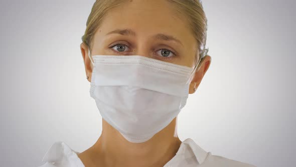 Business Woman in a Protective Medical Mask on Gradient Background