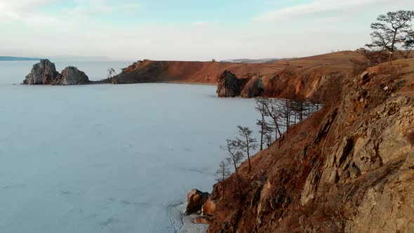 Amazing Natural Landscape in Winter Day Aerial View Frozen Lake and Rocky Shore