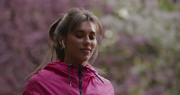 Pretty Sporty Woman Jumping Rope in the Park Slow Motion