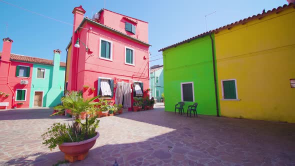 Wide Yard with Colorful Houses Lighted By Bright Sun