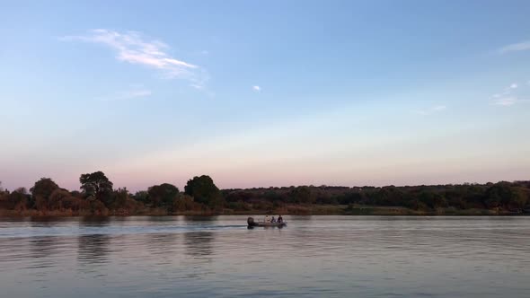 Local fishermen in their small boat on Chobe River in central Africa