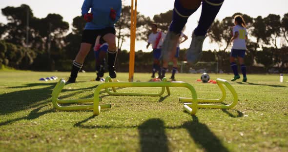 Female soccer team training on soccer field 4k